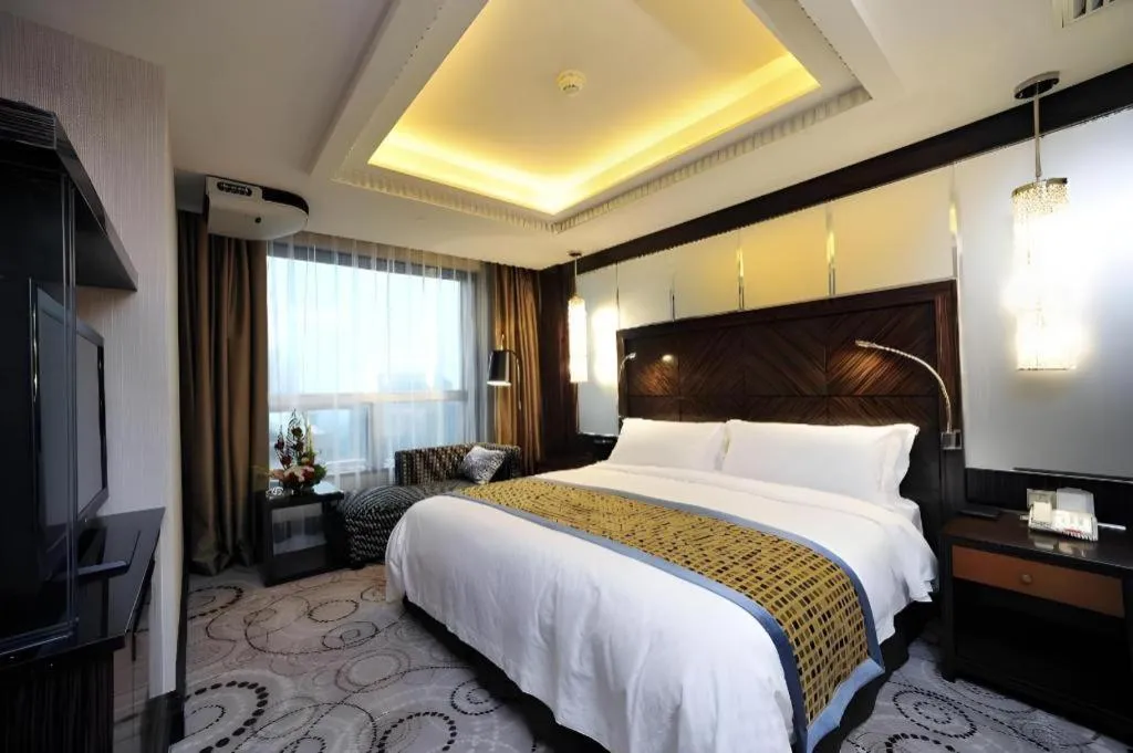 Bed in Grand Soluxe Zhongyou Hotel