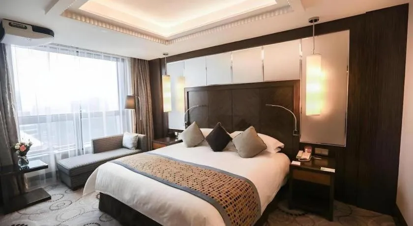 Bed in Grand Soluxe Zhongyou Hotel