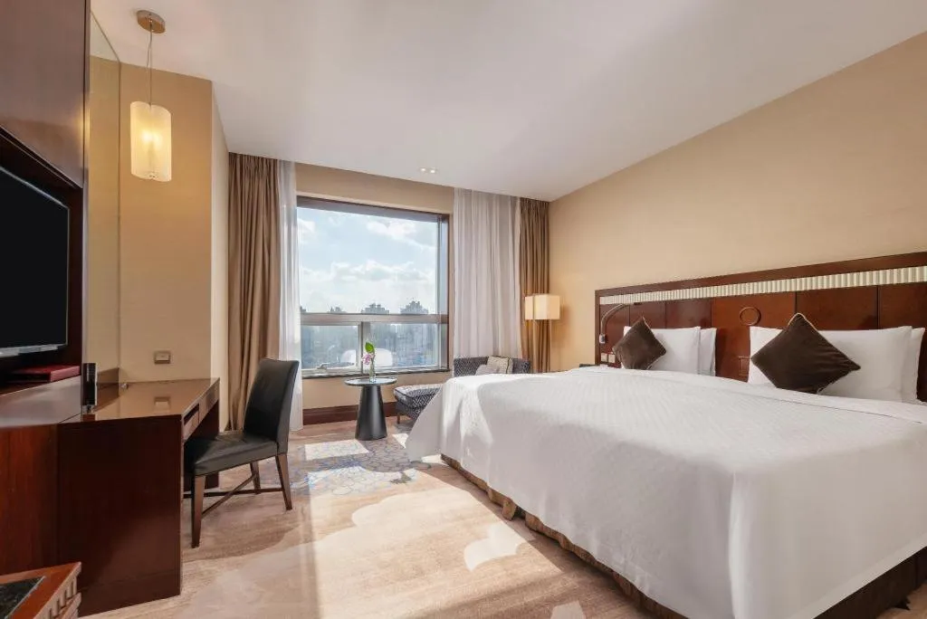 Bed in Grand Soluxe Zhongyou Hotel