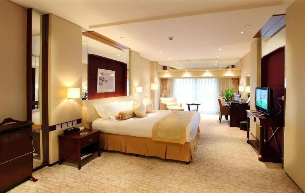 Bed in West International Trade Grand Hotel