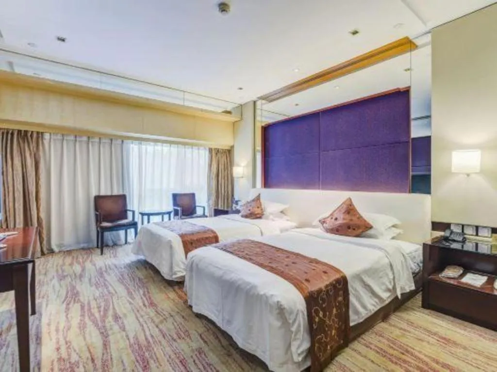 Bed in West International Trade Grand Hotel