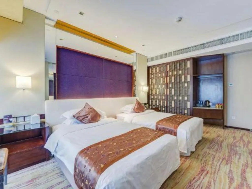 Bed in West International Trade Grand Hotel