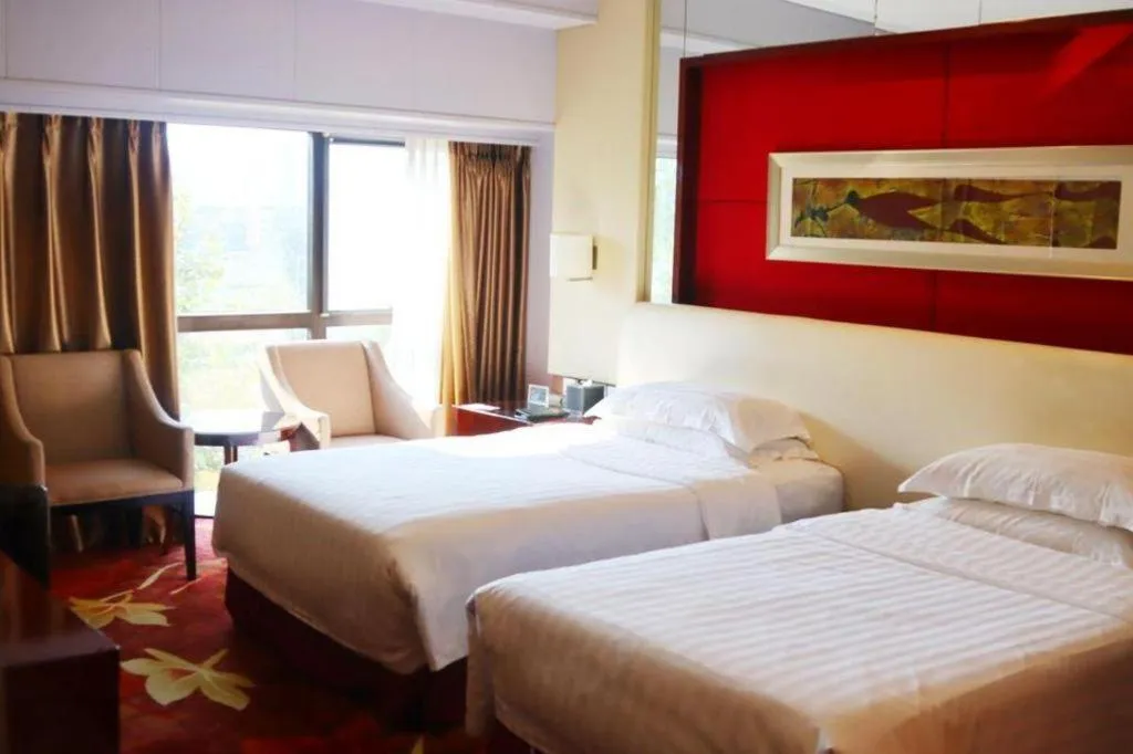 Bed in West International Trade Grand Hotel