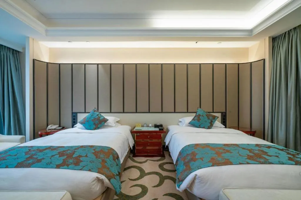 Bed in West International Trade Grand Hotel