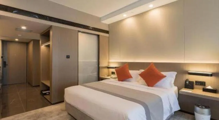 Bed in West International Trade Grand Hotel