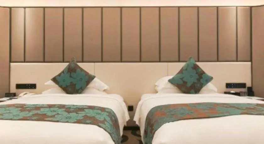 Bed in West International Trade Grand Hotel