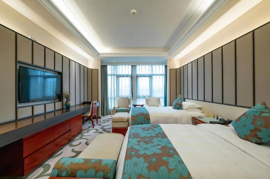 Bed in West International Trade Grand Hotel