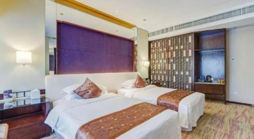 Bed in West International Trade Grand Hotel