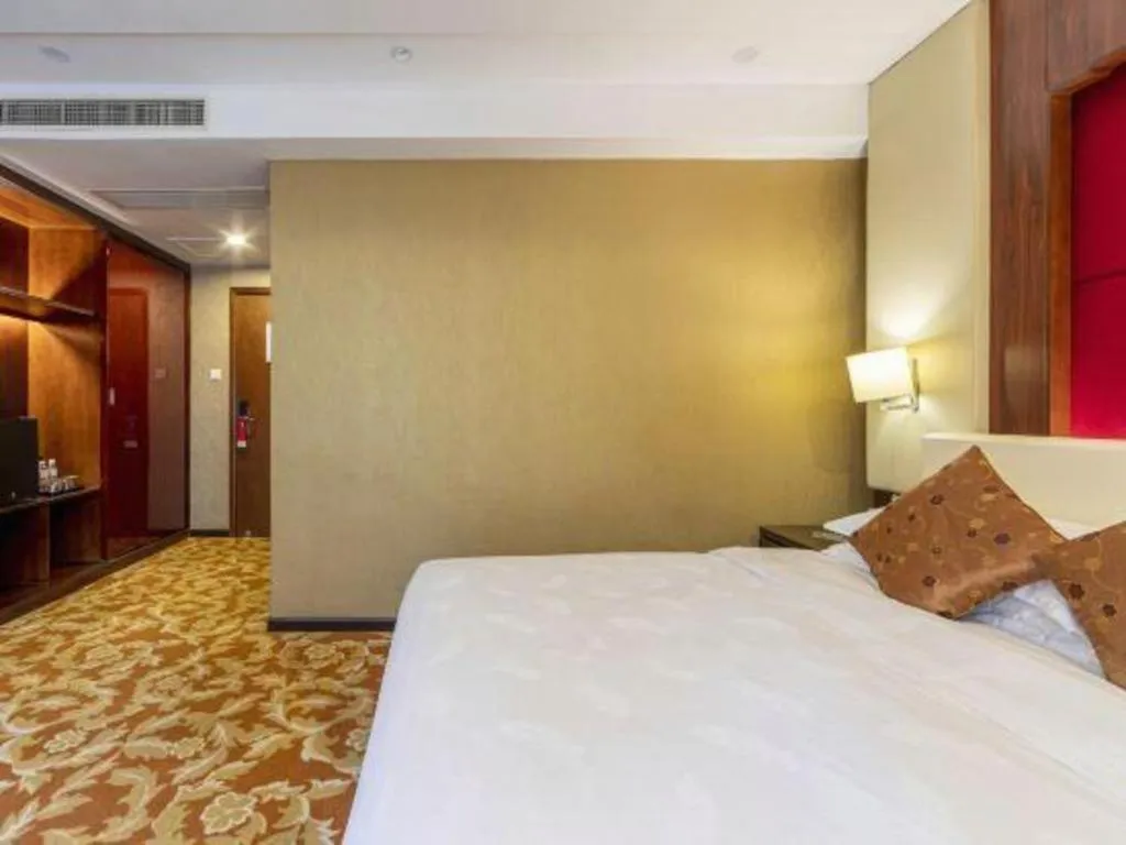 Bed in West International Trade Grand Hotel