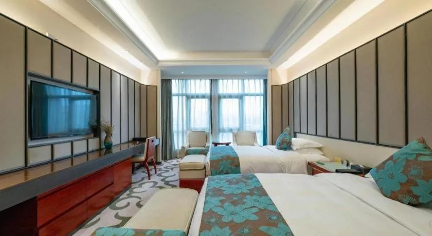 Bed in West International Trade Grand Hotel