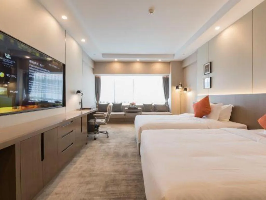 Bed in West International Trade Grand Hotel