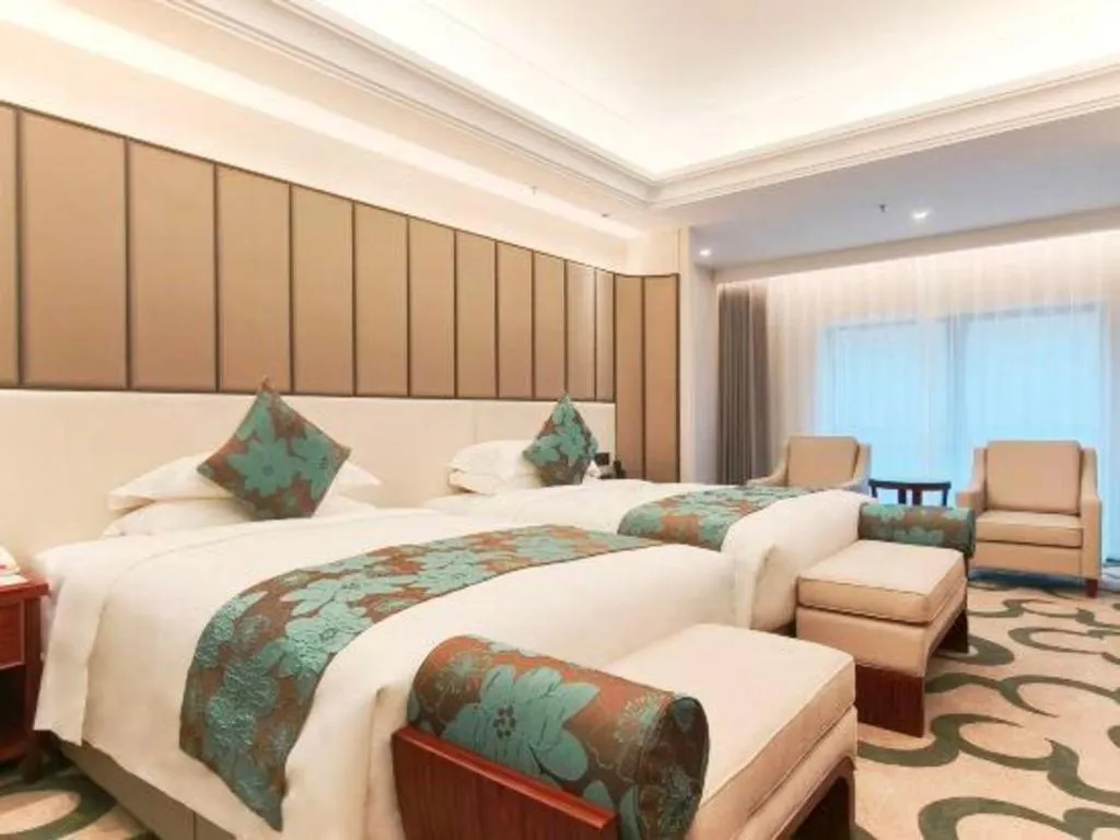 Bed in West International Trade Grand Hotel