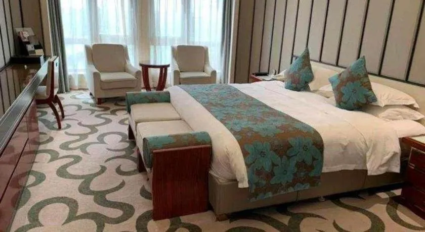 Bed in West International Trade Grand Hotel