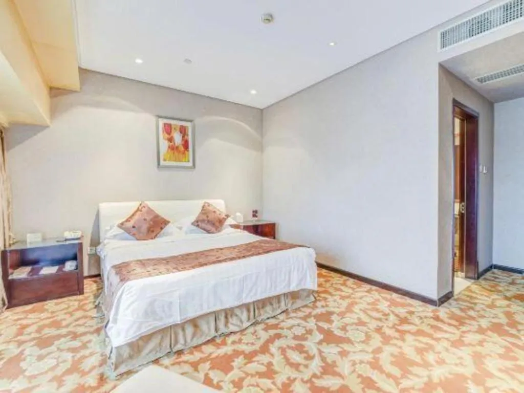 Bed in West International Trade Grand Hotel