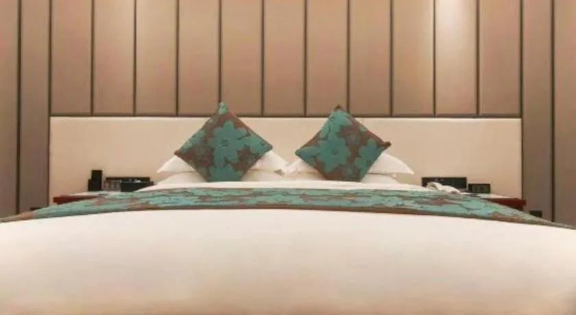 Bed in West International Trade Grand Hotel