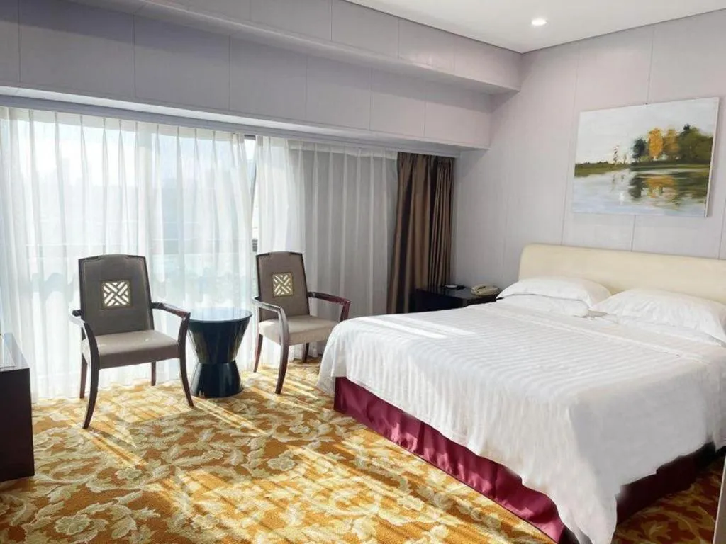 Bed in West International Trade Grand Hotel