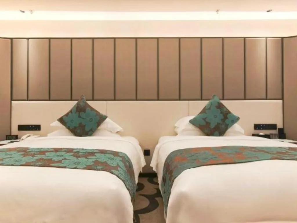 Bed in West International Trade Grand Hotel