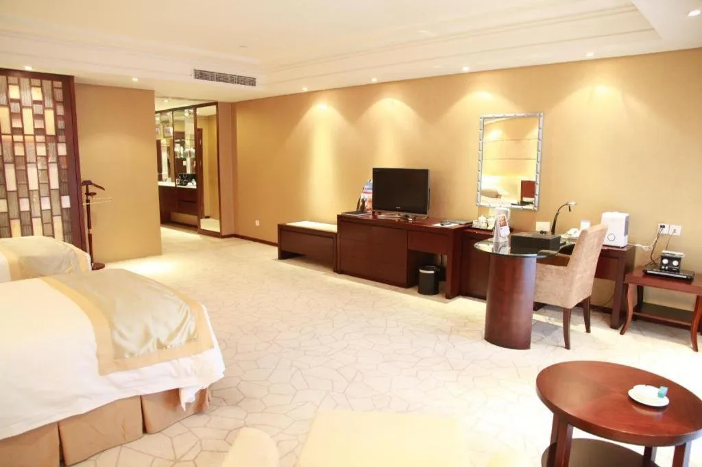 Bed in West International Trade Grand Hotel