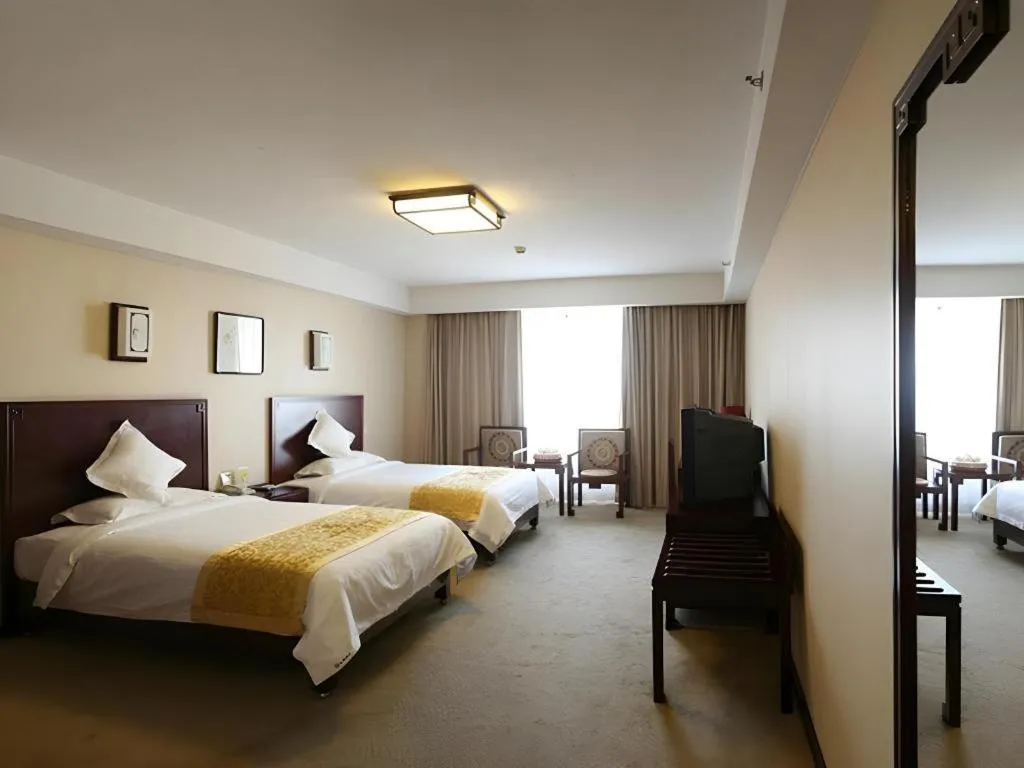 Bed in Beijing Ruyi Business Hotel