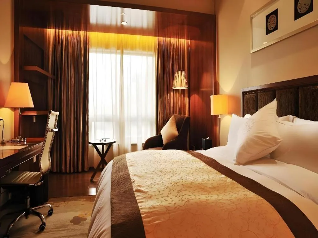 Bed in Yangzhou Hentique Huijin Resort Hotel