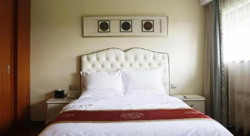 Bed in Yangzhou Hentique Huijin Resort Hotel