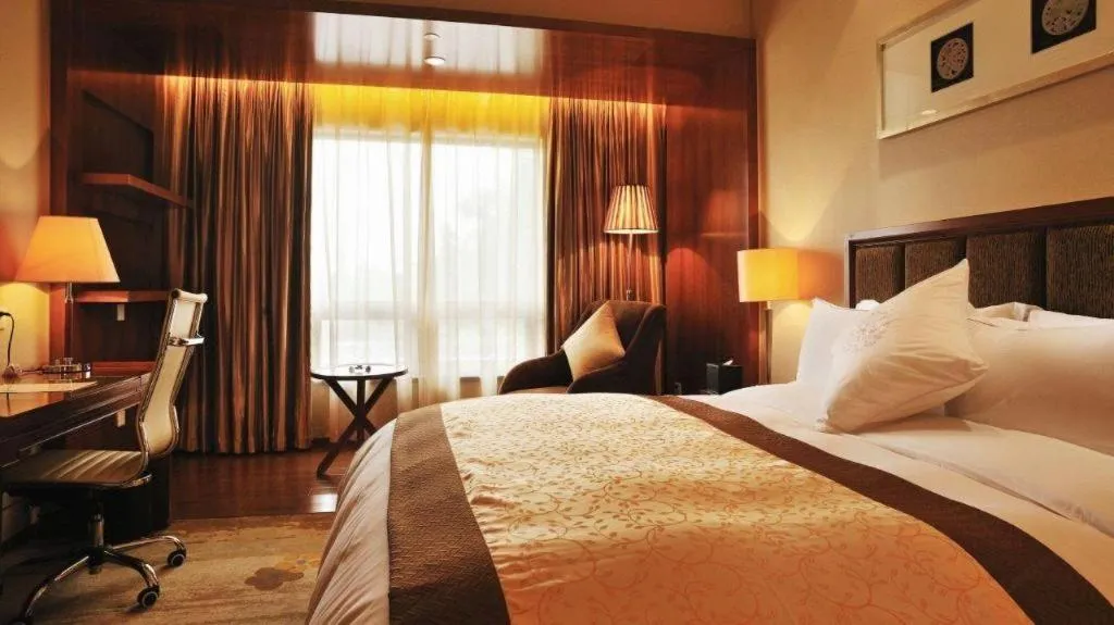 Bed in Yangzhou Hentique Huijin Resort Hotel