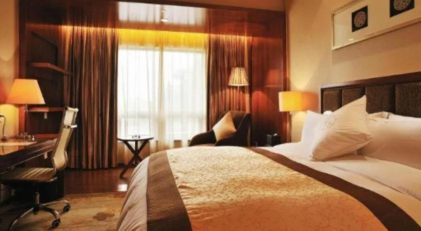 Bed in Yangzhou Hentique Huijin Resort Hotel