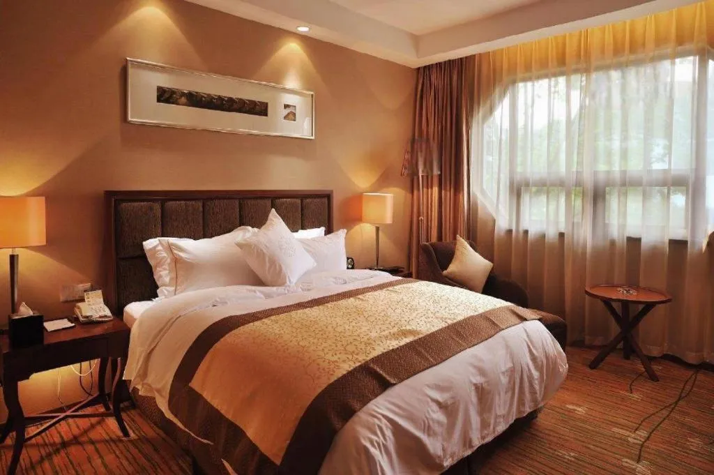 Bed in Yangzhou Hentique Huijin Resort Hotel