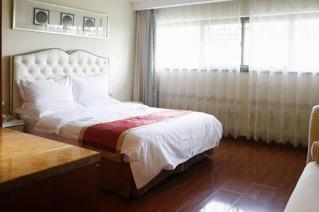 Bed in Yangzhou Hentique Huijin Resort Hotel