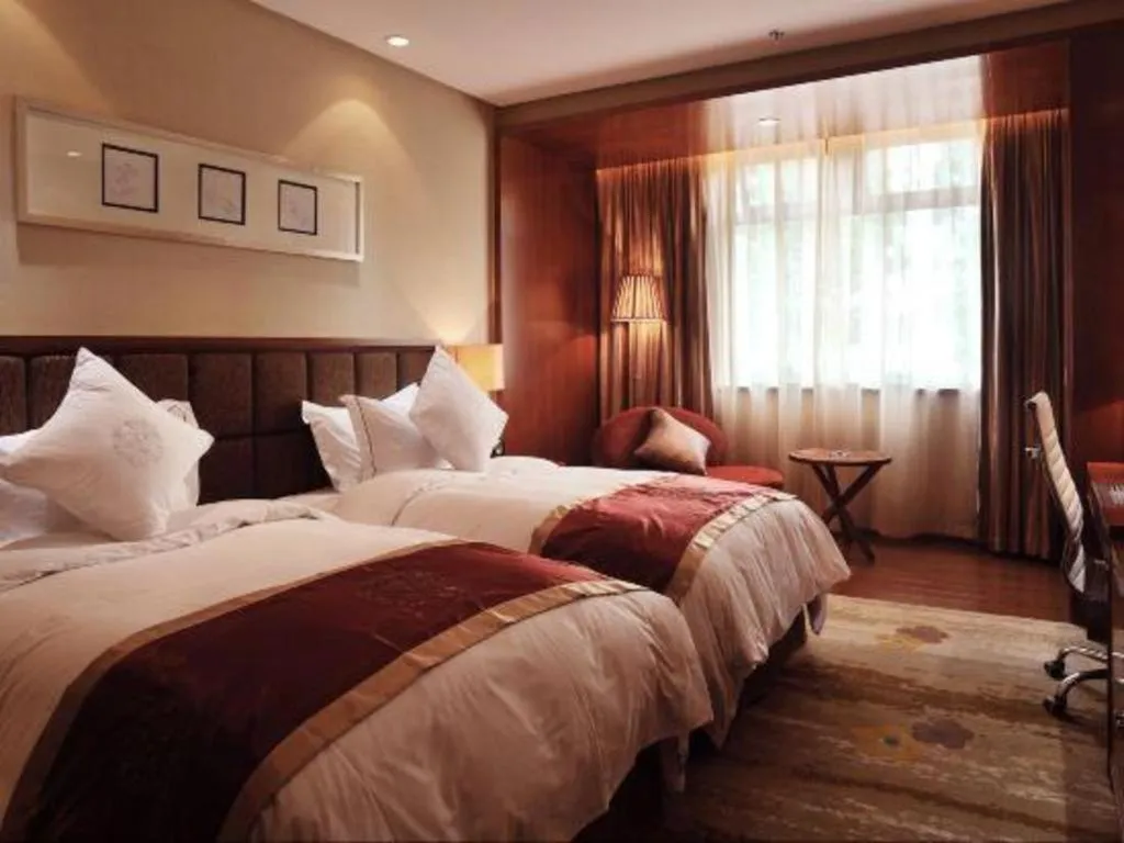 Bed in Yangzhou Hentique Huijin Resort Hotel