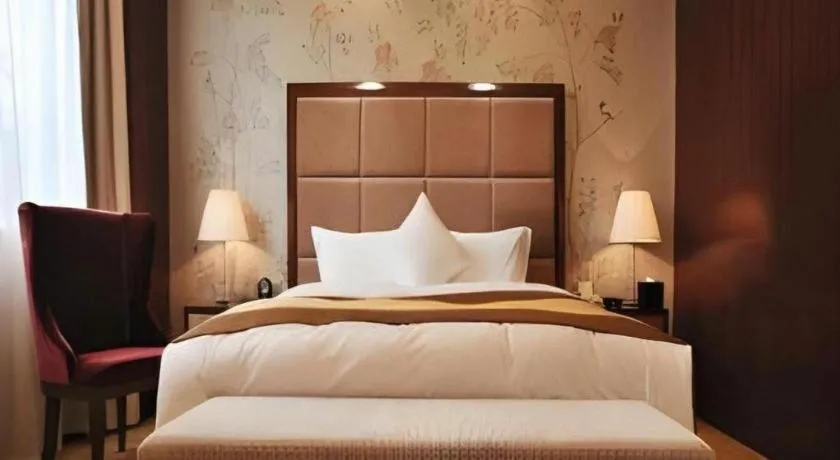 Bed in Yangzhou Hentique Huijin Resort Hotel