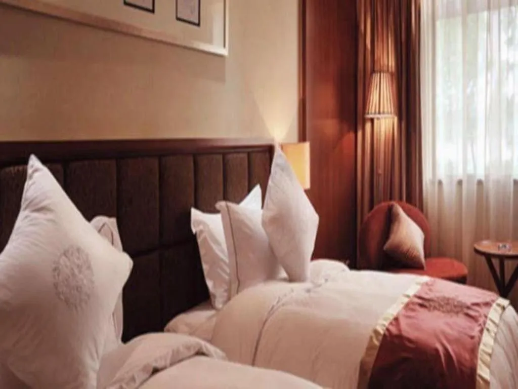 Bed in Yangzhou Hentique Huijin Resort Hotel