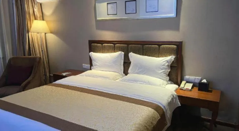 Bed in Yangzhou Hentique Huijin Resort Hotel