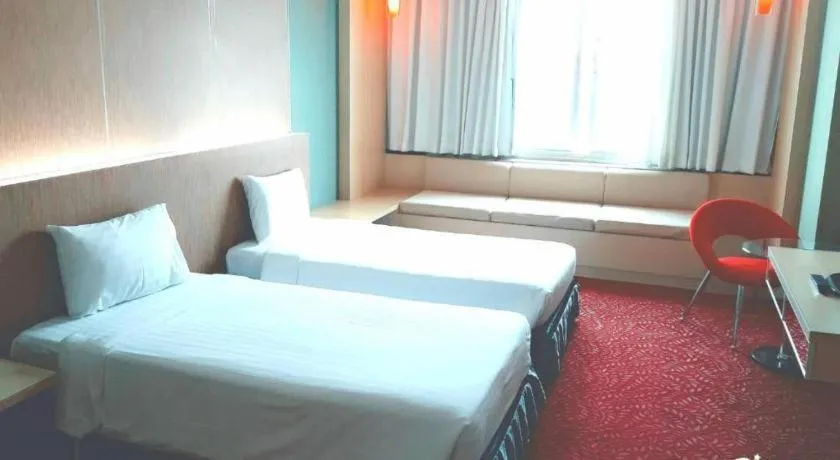 Bed in V-One Hotel Korat