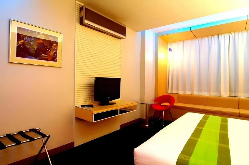 Bed in V-One Hotel Korat