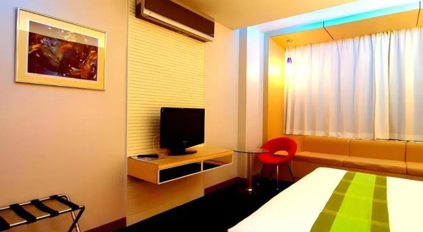 Bed in V-One Hotel Korat