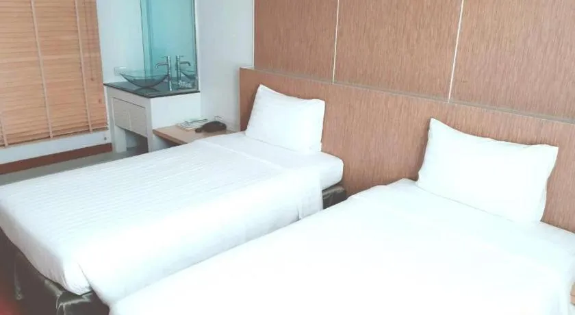 Bed in V-One Hotel Korat