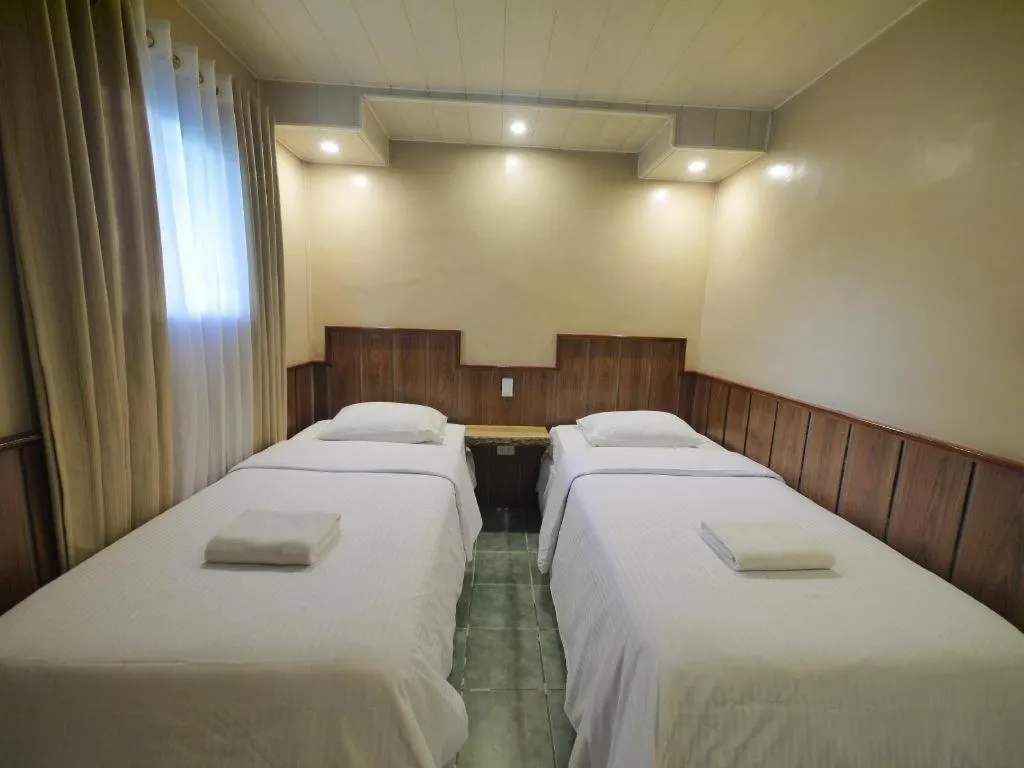 Bed in Mountain Lodge Hotel and Restaurant