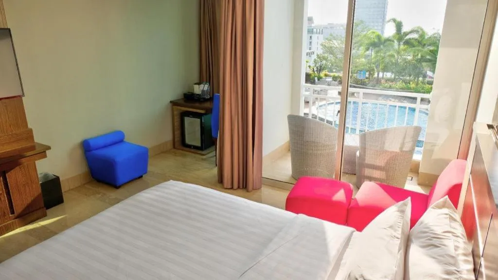 Bed in CLARO Makassar Hotel & Convention