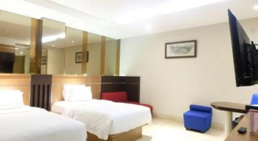 Bed in CLARO Makassar Hotel & Convention