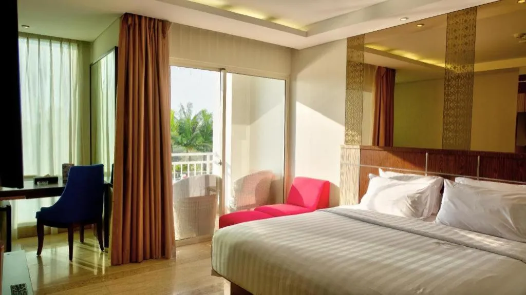 Bed in CLARO Makassar Hotel & Convention