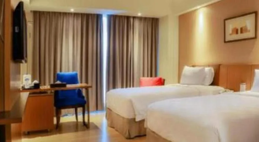 Bed in CLARO Makassar Hotel & Convention