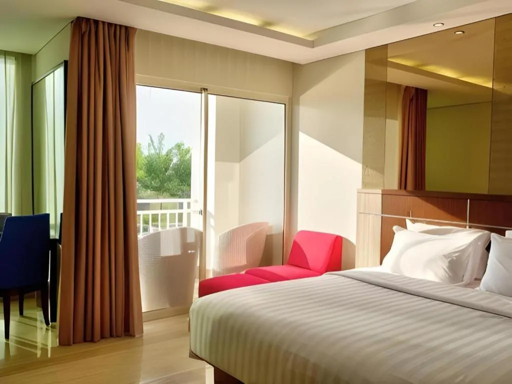 Bed in CLARO Makassar Hotel & Convention