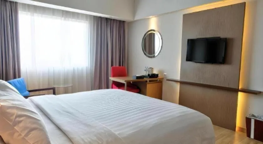 Bed in CLARO Makassar Hotel & Convention