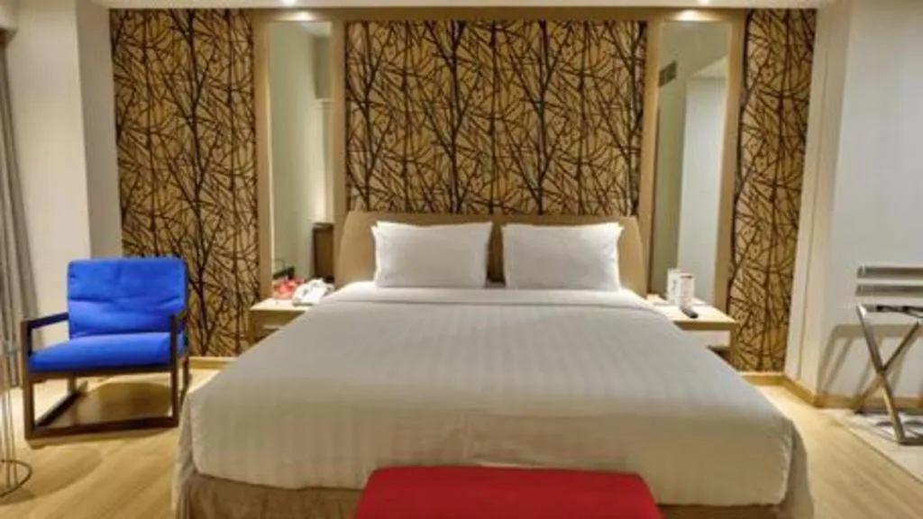 Bed in CLARO Makassar Hotel & Convention