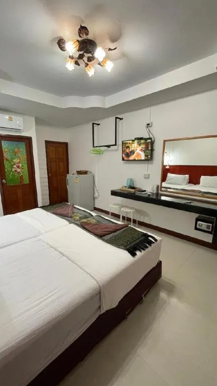 Bed in Jirawan Hotel