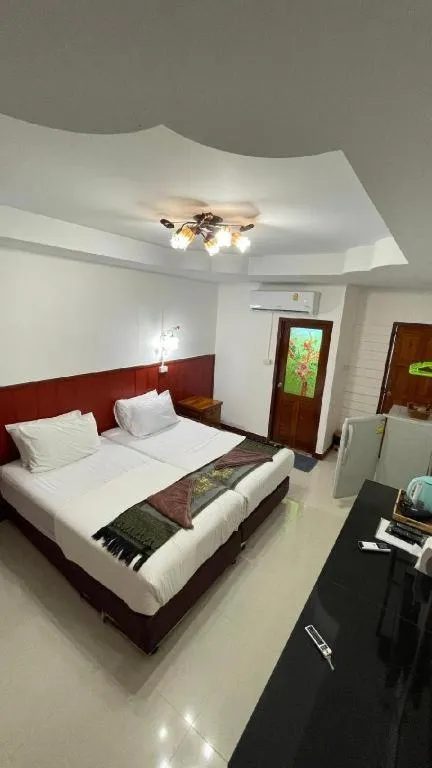 Bed in Jirawan Hotel