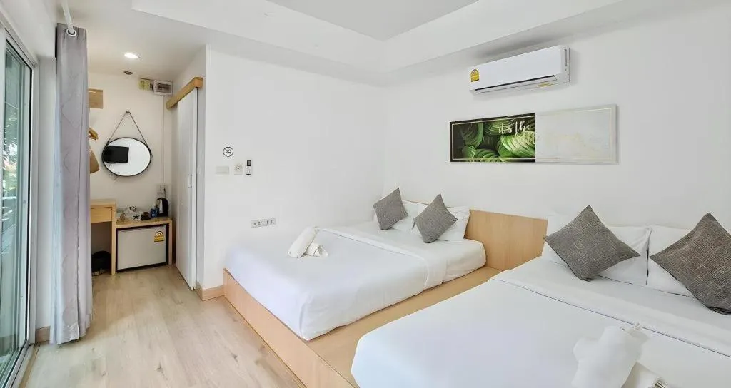 Bed in Sawasdee Coco Resort