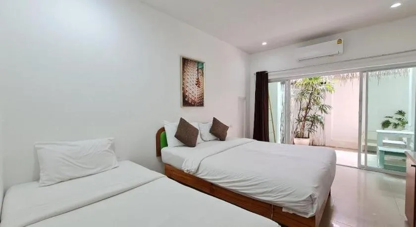 Bed in Sawasdee Coco Resort