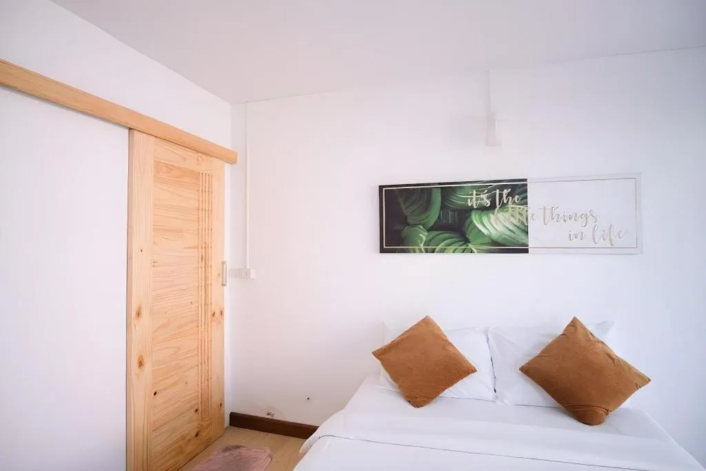 Bed in Sawasdee Coco Resort